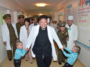 North Korean leader Kim Jong Un, centre, plays with children during a visit to the Taesongsan General Hospital in this undated photo released by North Korea's Korean Central News Agency (KCNA) in Pyongyang on May 19, 2014. (REUTERS/KCNA)