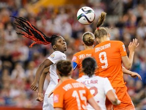 Kadeisha Buchanan #3 of Canada and Vivianne Miedema #9 of the Netherlands jump for the ball during the 2015 FIFA Women's World Cup Group A match at Olympic Stadium on June 15, 2015 in Montreal, Quebec, Canada. (Minas Panagiotakis/Getty Images/AFP)