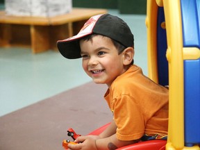 Three-year-old Dante Rocca is all smiles as he plays in the tunnel in the gym at the Walden Daycare open house in Walden, Ont. on Thursday June 18, 2015. Gino Donato/Sudbury Star