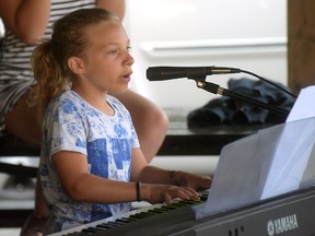 Tillsonburg's Charlotte Bolton, 11, performs her song, Strong, at Summer Daze on June 17 at Memorial Park. (CHRIS ABBOTT/TILLSONBURG NEWS)