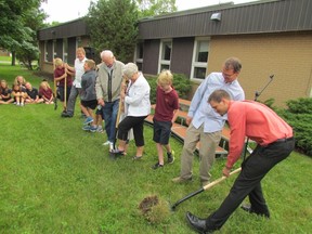 Taking part in a ground-breaking ceremony on Friday June 19, 2015 in Sarnia, Ont., for a $1.2-million addition to Sarnia Christian School are, from right, Craig Hoekema, Allan Farris, Joey McNeil, Marguerite Schenk and her great-granddaughter Claire Schenk, Martin Tamming, Niklaas Botma, Travis Bouma and Quintin Bouma.  Paul Morden/Sarnia Observer/Postmedia Network