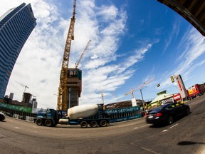 Cranes are pictured June 7, 2015, in downtown Edmonton, near the construction site of Rogers Place, the new downtown arena slated to open fall, 2016. (Max Maudie/Edmonton Sun)