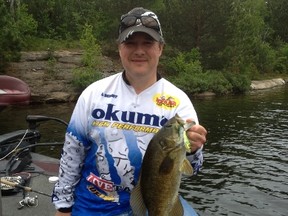 Garson native and pro angler Al Benoit shows off a chunky smallmouth caught on a topwater bait earlier this week in Greater Sudbury.