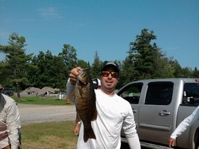 Nickel City Bass club president Marty Guenette shows off a nice smallmouth caught during a tournament last year. The club's tournament series begins next weekend.