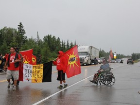 A rally group slowing traffic at the Manitoba-Ontario border to raise awareness of murdered and missing aboriginal women on Friday June 19, 2015. Amber McGuckin/Kenora Daily Miner and News/Postmedia Network