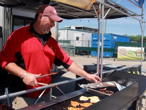 Terry Slowka fires up the grill at Smokin' Joes, the only entry from Sarnia in this year's Ribfest. The annual Ribfest event is being held this weekend at Hiawatha Horsepark. (Chris O'Gorman, Sarnia Observer)