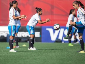 Colombia's Isabella Echeverri, right, kicks the ball during the team's training session Friday at the Clareview soccer complex. (AFP)