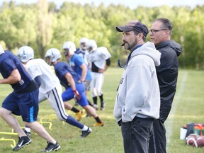 Sudbury Spartans head coach Junior LaBrosse keeps an eye on his charges during team practice in Sudbury, Ont. on Thursday June 18, 2015.