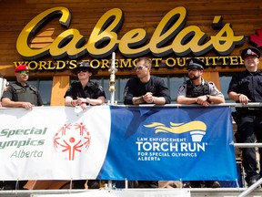 (left to right) Military Police Officer Fred Savard, Sheriff Dennette Harrison, Corrections Officer Sheridan Taylor, Peace Officer Steve Schmidt, and EPS Cst. Ryan May are camping on the roof of Cabela's (6150 Currents Drive) for 53 hours as part of a the Free The Fuzz fundraiser for the Special Olympics, in Edmonton Alta. on Friday June 19, 2015. David Bloom/Edmonton Sun/