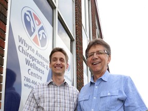 Dr. Chris Brodeur (left) and his father Dr. Bob Brodeur pose in front of their clinic in Edmonton.  Perry Mah/Edmonton Sun