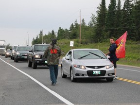 A group handed out flyers about the need for a murdered and missing indigenous women inquiry to drivers at the Manitoba-Ontario boundary. (Amber McGuckin/Kenora Daily Miner and News)