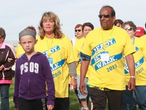 From left, seven-year-old Ava Hayes, her grandmother Sandi Torma, and Sheikh Mohammed, all from Sarnia, walk the survivor’s lap at the Relay For Life in Sarnia Friday. Torma and Mohammed were two of between 120 and 130 cancer survivors who participated in the survivor’s lap to open the 2015 relay. (Terry Bridge, Sarnia Observer)