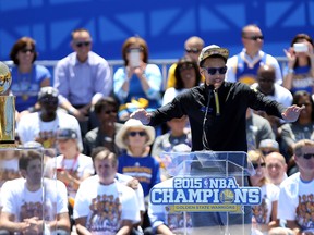 Warriors guard Stephen Curry speaks during the team's NBA championship celebration at the Henry J. Kaiser Convention Center in Oakland on Friday, June 19, 2015. (Kelley L Cox/USA TODAY Sports)