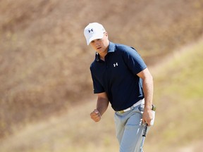 Jordan Spieth of the United States celebrates after a birdie putt on the ninth green during the second round of the 115th U.S. Open Championship at Chambers Bay on June 19, 2015 in University Place, Washington. (Harry How/Getty Images/AFP)