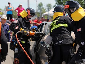 Rescue team from Oakville rescues an unconscious driver from her vehicle. Steph Crosier, The Whig-Standard, Postmedia Network.