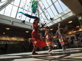 (Right to left) Alexandra Yellowbird, 11, Pisim Yellowbird, 8, and Ryley Hunter, 10, with Heavenly Skies Dance Society, perform a woman's dance at Muttart Conservatory in Edmonton, Alta., on Saturday, June 21, 2014. June 21 is National Aboriginal Day. Ian Kucerak/Edmonton Sun/QMI Agency