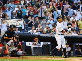 Alex Rodriguez of the New York Yankees hits a home run as well as getting his 3000th career hit in the first inning against Justin Verlander of the Detroit Tigers Detroit Tigers during their game at Yankee Stadium on June 19, 2015. (Al Bello/Getty Images/AFP)