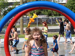 Allie Weldon-Parker, 8, cools off on the splash pad at Victory Park in Sudbury, Ont. on June 20, 2015. The splash pad was officially opened during a ceremony which recognized the contribution of the City of Greater Sudbury,  the Ontario Trillium Foundation, DEWCAN, the Loyal Order of Moose Sudbury Lodge 230 and the local community. John Lappa/Sudbury Star