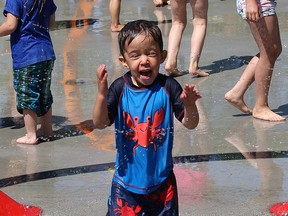 Landyn Peters, 4, cools off on the splash pad at Victory Park in Sudbury, Ont. on Saturday June 20, 2015. The splash pad was officially opened during a ceremony which recognized the contribution of the City of Greater Sudbury,  the Ontario Trillium Foundation, DEWCAN, the Loyal Order of Moose Sudbury Lodge 230 and the local community. John Lappa/Sudbury Star/Postmedia Network