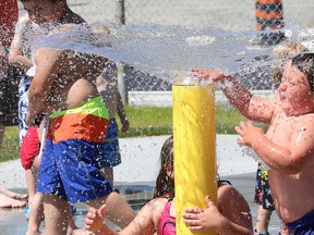 Liam White, 3, cools off on the splash pad at Victory Park in Sudbury, Ont. on Saturday June 20, 2015. The splash pad was officially opened during a ceremony which recognized the contribution of the City of Greater Sudbury,  the Ontario Trillium Foundation, DEWCAN, the Loyal Order of Moose Sudbury Lodge 230 and the local community. John Lappa/Sudbury Star/Postmedia Network