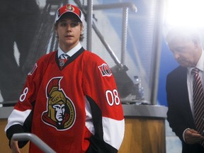 Erik Karlsson dons the Senators jersey after being selected 15th overall in the 2008 NHL Entry Draft. It  turned out to be one of the best draft picks in team history. (Ottawa Sun Files)