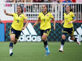 Jun 13, 2015; Moncton, New Brunswick, CAN; Colombia forward Lady Andrade (16) celebrates after scoring a goal during the first half against France in a Group F soccer match in the 2015 FIFA women's World Cup at Moncton Stadium. Mandatory Credit: Matt Kryger-USA TODAY Sports