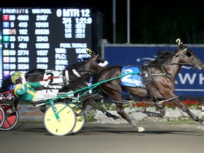 Wakizashi Hanover races to victory over Wiggle it Jiggleit at the $1-million North America Cup at Mohawk Racetrack last night. )Clive Cohen/New Image Media)