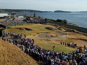 Jordan Spieth of the United States tees off on the 17th hole during the third round of the 115th U.S. Open Championship at Chambers Bay on June 20, 2015 in University Place, Washington. (Mike Ehrmann/AFP)
