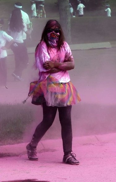 A woman walks through the Pink Zone at the Graffiti Run at Rundle Park in Edmonton, Alberta on Sunday, June 21, 2015. Perry Mah/Edmonton Sun/Postmedia Network