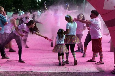 Runners go through the Pink Zone at the Graffiti Run in Rundle Park in Edmonton, Alberta on Sunday, June 21, 2015. Perry Mah/Edmonton Sun/Postmedia Network