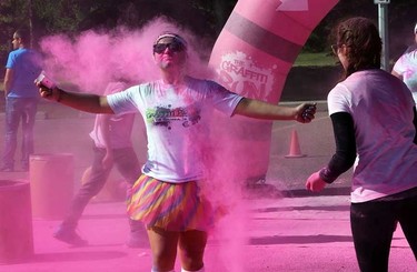 A runner gets hit in the Pink Zone during the Graffiti Run at Rundle Park in Edmonton, Alberta on Sunday, June 21, 2015. Perry Mah/Edmonton Sun/Postmedia Network