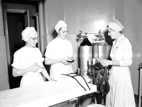Shirley McLarty, Letitia Lannin and Dorothy Knight are shown during nursing training in the operating room at the former Sarnia General Hospital in 1951 in this photo from the Lambton County Archives, Sarnia Observer Negative Collection. A reunion of the former hospital nurses training program is planned for July 4 at the Holiday Inn in Point Edward. Handout/Sarnia Observer/Postmedia Network