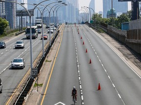 The eastbound lanes of the Gardiner Expressway were closed to cars Sunday from the Humber River to Carlaw Ave., from 2 a.m. to noon, for a triathlon. (DAVE THOMAS, Toronto Sun)
