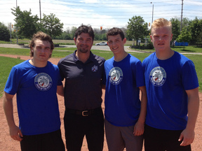 Sudbury Wolves coach Dave Matsos poses with Shane Bulitka, Macauley Carson and Owen Lane at a summer training session in Mississauga last weekend. Photo supplied