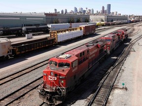 A Canadian Pacific Railway crew works on their train at the CP Rail yards in Calgary, Alberta, April 29, 2014. REUTERS/Todd Korol