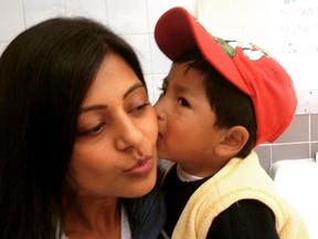 Photo supplied
Sudbury orthodontist Inderpreet Virdee gets a kiss from Willie, a Peruvian boy who had surgery for a cleft palate.