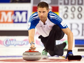 Team British Columbia skip John Morris delivers a stone in the 5th end against team Alberta during the championship draw at the 2014 Tim Hortons Brier curling championships in Kamloops, British Columbia March 9, 2014.  (REUTERS/Ben Nelms)