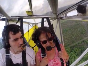 A stowaway cat surprised two people during an open-cockpit glider flight in Kourou, French Guiana. (YouTube screengrab)
