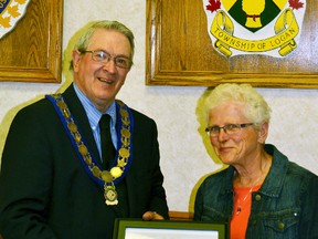 West Perth Mayor Walter McKenzie presented Carol Siemon with a plaque recognizing her as the Senior of the Year at the June 15 council meeting. GALEN SIMMONS/MITCHELL ADVOCATE