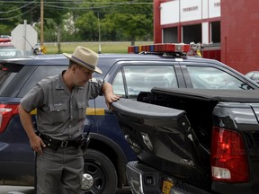 New York State Police engage in a manhunt for two prisoners Richard Matt and David Sweat in Friendship, N.Y., on June 21, 2015. (REUTERS/Aaron Harris)