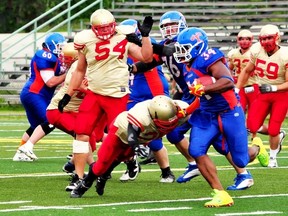 Jimmy Purves of the Sarnia Imperials dives for a tackle with teammate Josh Hardy, No. 54, and Terry Mauldin, No. 22, rushing in from the side. The Imperials scored on their first possession of the Northern Football Conference game Saturday at Norm Perry Park, but that was it offensively in a 21-3 loss to the Ottawa Invaders.  Handout/Sarnia Observer/Postmedia Network