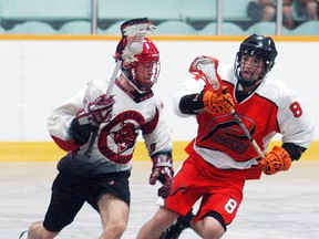 Wallaceburg Red Devils player Derrick Hastings runs by a Point Edward Pacers player during a game held at Wallaceburg Memorial Arena on June 17. The Red Devils will play Six Nations in the OLA Western Conference quarter-finals.