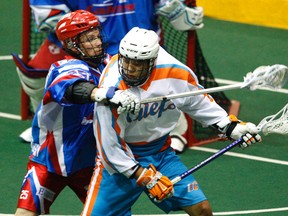 Peterborough Lakers' Brad Self pressures Six Nations Chiefs' Johnny Powless during a Major Series Lacrosse game Thursday, June 18, 2015, at the Memorial Centre in Peterborough, Ont. (Clifford Skarstedt/Peterborough Examiner/Postmedia Network)
