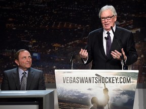 NHL commissioner Gary Bettman (left) looks on as Fidelity National Financial Inc. Chairman and President of Hockey Vision Las Vegas Bill Foley speaks during a news conference at the MGM Grand Hotel & Casino in Las Vegas announcing the launch of a season ticket drive to try to gauge if there is enough interest in the city to support an NHL team on Feb. 10, 2015. (Ethan Miller/Getty Images/AFP)