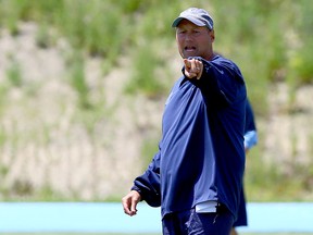 Argonauts head coach Scott Milanovich — right, giving orders at practice yesterday — and GM Jim Barker received contract extensions from the new Toronto ownership group. QB Ricky Ray is now playing in final year of his deal. (DAVE ABEL/TORONTO SUN)