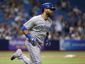 Blue Jays designated hitter Jose Bautista hits a solo home run during the sixth inning against the Rays at Tropicana Field in St. Petersburg, Fla., on Monday, June 22, 2015. (Kim Klement/USA TODAY Sports)
