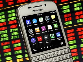 A Blackberry Q10 smartphone is seen in front of a displayed stock graph in this photo illustration taken in Zenica, Bosnia and Herzegovina, in this May 22, 2015, file photo. REUTERS/Dado Ruvic/Files