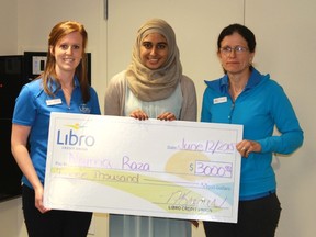 Naima Raza accepts a cheque for $3,000 from Libro Credit Union representatives on June 12. Raza was one of ten recipients across southwestern Ontario to win Libro Credit Union's annual Student Award. 
CARL HNATYSHYN/SARNIA THIS WEEK