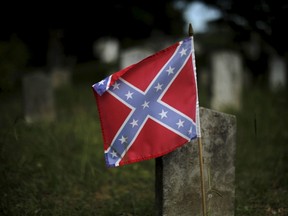 A Confederate battle flag marks the graves of soldiers in the Confederate States Army in the U.S. Civil War in Magnolia Cemetery in Charleston, S.C., on June 22, 2015. (REUTERS/Brian Snyder)