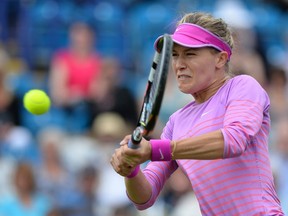 Eugenie Bouchard returns the ball to Alison Riske of the US during their women's singles second round match at the WTA Eastbourne International tennis tournament in Eastbourne, southern England on June 23, 2015. Bouchard won 7-6, 6-3.  AFP PHOTO / GLYN KIRK